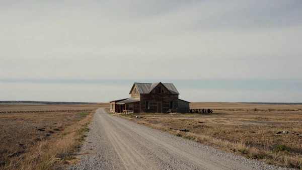 Lonely farmhouse on open prairie illustrating rural dating challenges and geographic isolation